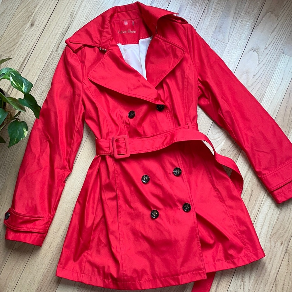 Bright red trench coat